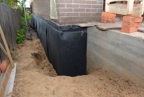 Happy homeowners after waterproofing job in Gladwyne